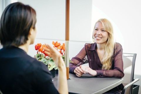 Businesswomen having lunch in cafe