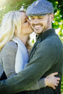 Caucasian couple kissing outdoors