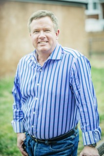 Close up of smiling Caucasian man standing outdoors