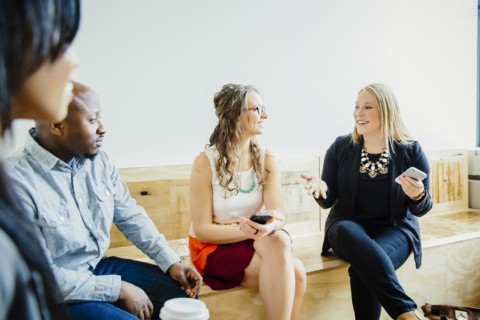 Business people talking in office lobby