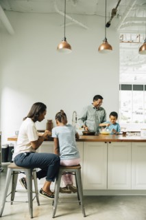 Family cooking in kitchen