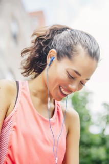 Indian athlete listening to earbuds