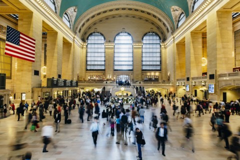Blurred view of people in train station