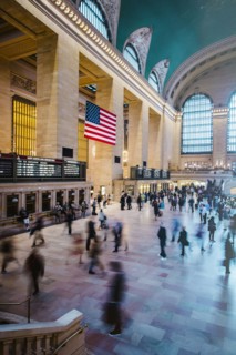 Blurred view of people in train station