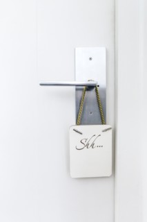 Do not disturb sign on hotel room doorknob
