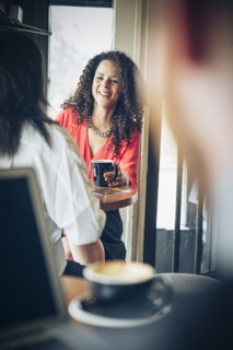 Businesswomen drinking coffee in cafe