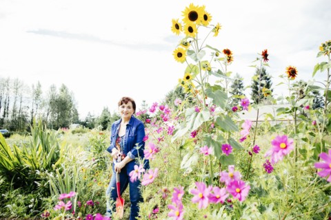 Caucasian woman smiling in garden