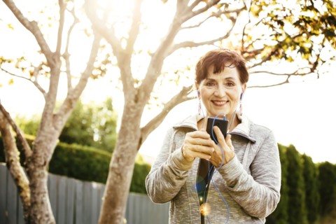 Caucasian woman using cell phone outdoors