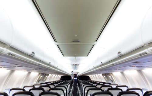Empty chairs and compartments in airplane
