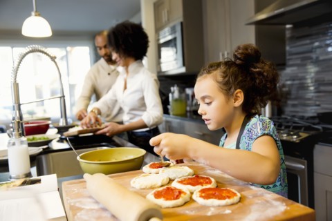 Family cooking in kitchen