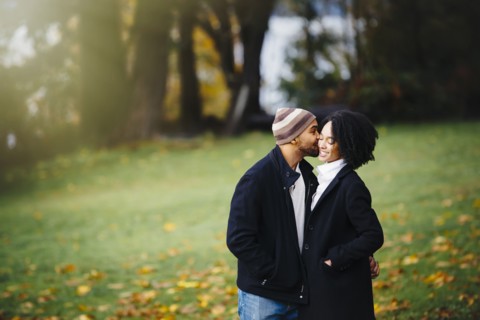 Couple kissing in park