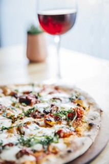 Glass of wine and pizza