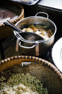 High angle view of pots of soup and rice