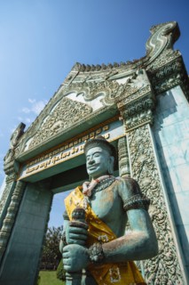 Low angle view of statue and ornate archway at Angkor Wat