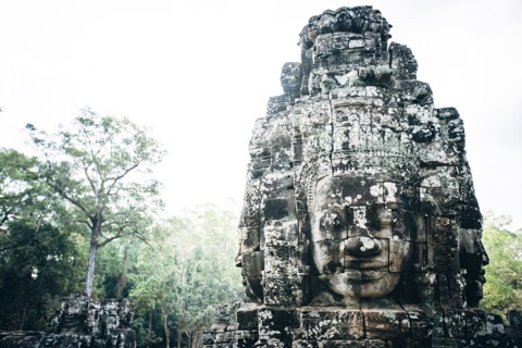Dilapidated statue and pillar at Angkor Wat