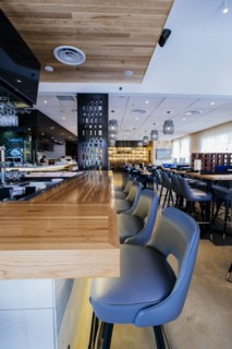 Tables and chairs in modern bar and restaurant