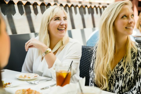 Caucasian customers smiling in restaurant
