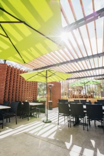 Green umbrellas in restaurant patio