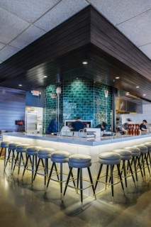 Multiple exposure of busy bartender at bar