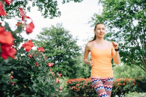 Smiling Caucasian woman running