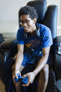 Black man playing video game