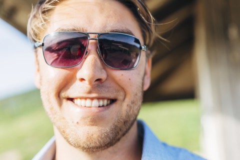 Smiling Caucasian man wearing sunglasses