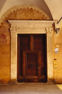 Ornate door with knocker in Bologna