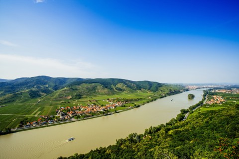Boats on river near village