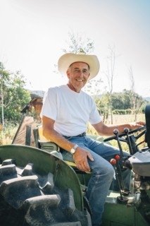 Caucasian farmer sitting on tractor