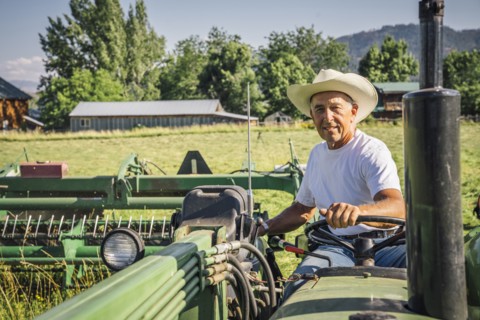 Portrait of Caucasian farmer on tractor
