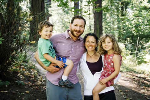 Portrait of smiling Caucasian family in park