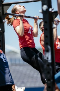 Caucasian woman doing chin-ups