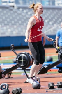 Caucasian woman jumping rope outdoors