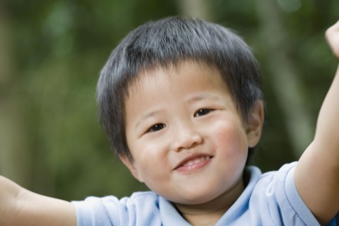 Close up of Asian boy smiling