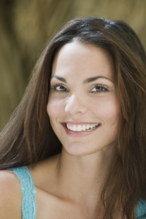 Close up of smiling Hispanic woman