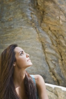 Hispanic woman looking up