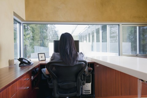 Asian businesswoman sitting at desk
