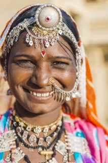 Smiling Indian woman wearing traditional jewelry