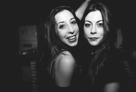 Smiling women dancing in nightclub