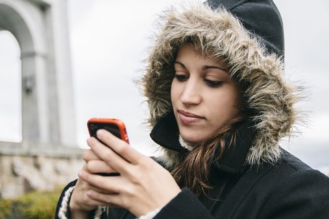 Caucasian woman using cell phone