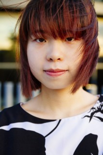 Close up of smiling Chinese woman in wind