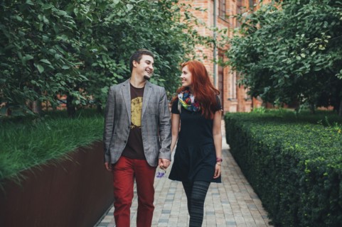 Smiling Caucasian couple walking in city