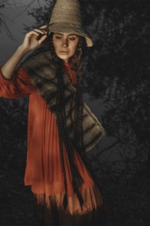 Caucasian woman wearing traditional clothing at night