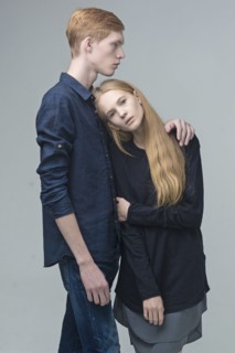 Portrait of serious Caucasian couple hugging