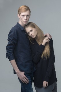 Portrait of serious Caucasian couple hugging