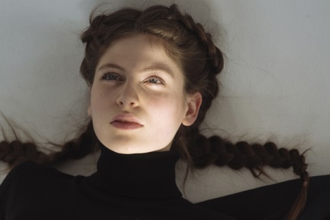Portrait of serious Caucasian woman looking up