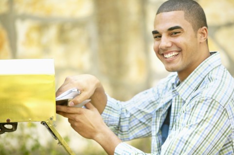 Man getting mail from mailbox