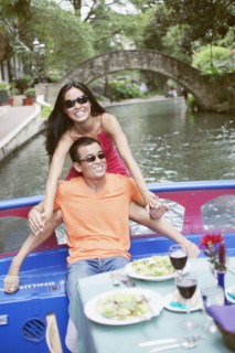 Young couple eating lunch on a boat