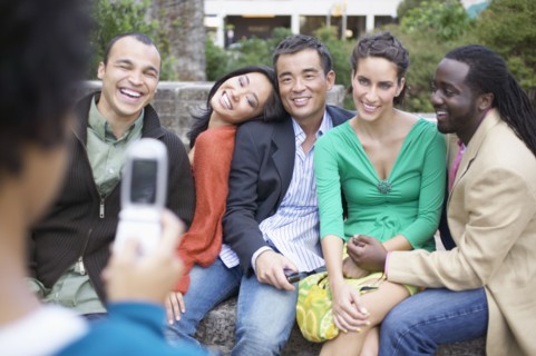Friends posing for snapshots