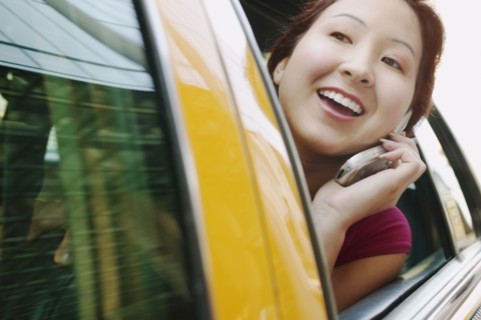 Woman looking through car window